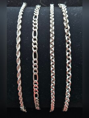 Set Of 4 Steel Stacking Bracelet Set.